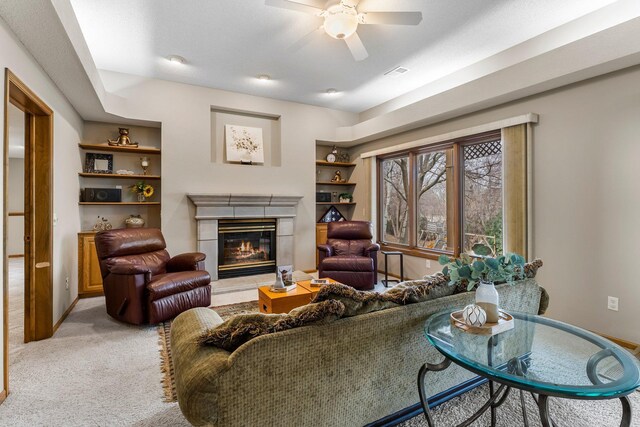 13162 Glenhaven Ave, Apple Valley, MN 55124 - living room with a fireplace, a ceiling fan, light carpet, and baseboards