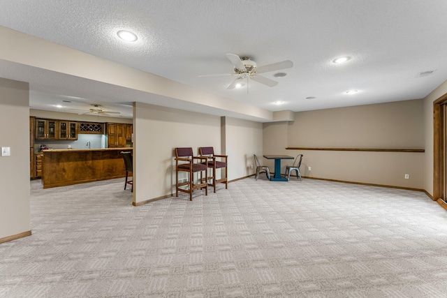 13162 Glenhaven Ave, Apple Valley, MN 55124 - below grade area with light carpet, wet bar, ceiling fan, a textured ceiling, and recessed lighting