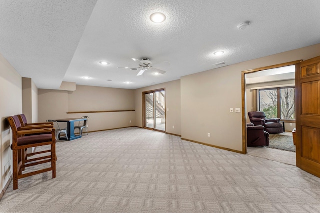 13162 Glenhaven Ave, Apple Valley, MN 55124 - basement with a textured ceiling, light colored carpet, baseboards, ceiling fan, and recessed lighting