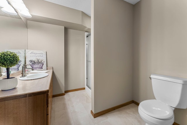 13162 Glenhaven Ave, Apple Valley, MN 55124 - full bath featuring toilet, a stall shower, vanity, and baseboards