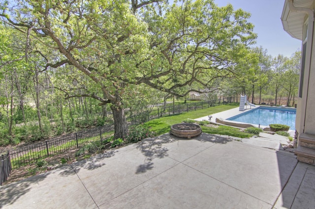 view of patio / terrace with an outdoor fire pit and a fenced backyard