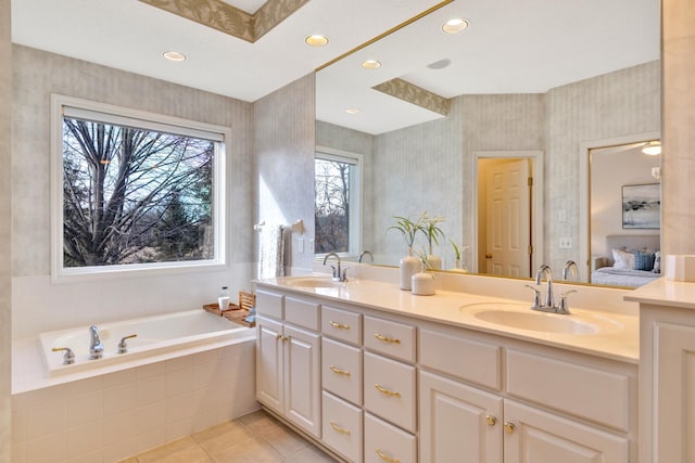 full bathroom with tile patterned floors, a garden tub, recessed lighting, double vanity, and connected bathroom