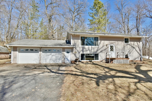 18045 Delaware Ln, Eden Lake Twp, MN 56362 - view of front of home with driveway, an attached garage, and a wooden deck