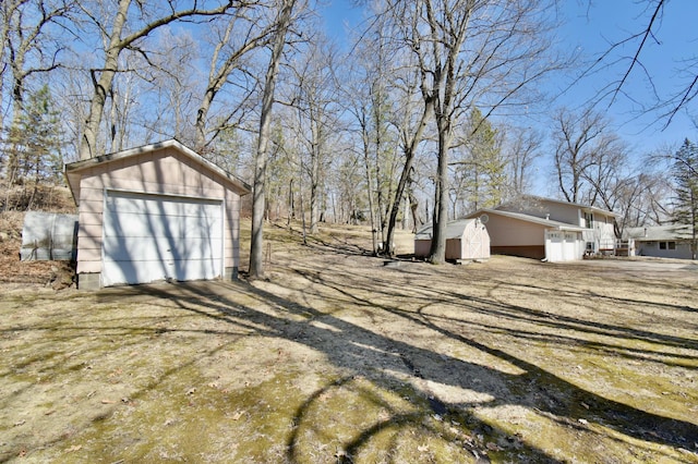 18045 Delaware Ln, Eden Lake Twp, MN 56362 - view of yard featuring an outbuilding and a detached garage