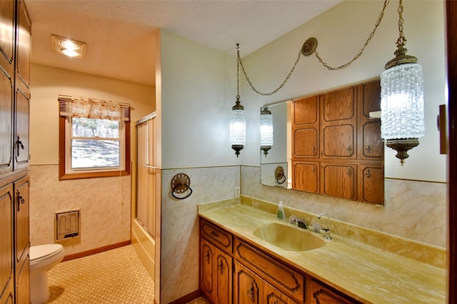 18045 Delaware Ln, Eden Lake Twp, MN 56362 - bathroom featuring vanity, toilet, and shower / bath combination with glass door