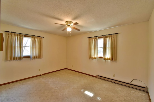 18045 Delaware Ln, Eden Lake Twp, MN 56362 - unfurnished room with baseboard heating, healthy amount of natural light, a ceiling fan, carpet, and a textured ceiling