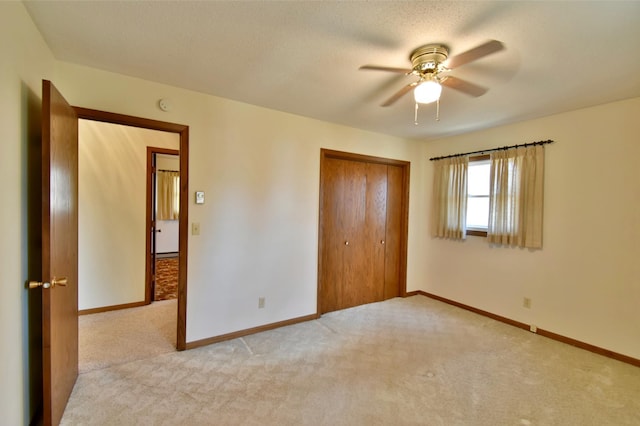 18045 Delaware Ln, Eden Lake Twp, MN 56362 - unfurnished bedroom featuring carpet floors, a closet, baseboards, and a ceiling fan