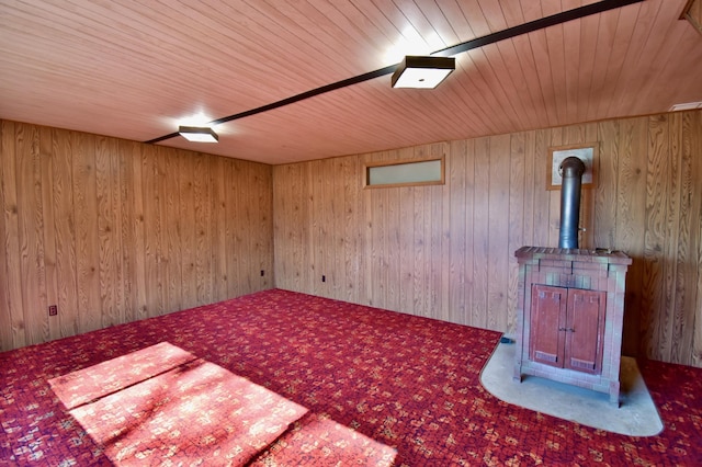 18045 Delaware Ln, Eden Lake Twp, MN 56362 - unfurnished living room with carpet floors, wooden ceiling, wood walls, and a wood stove