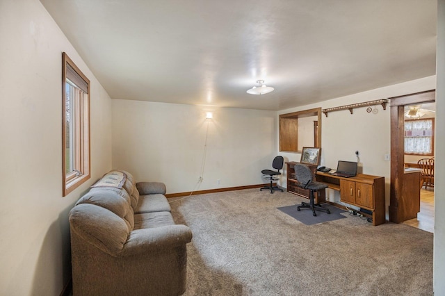 carpeted office with baseboards