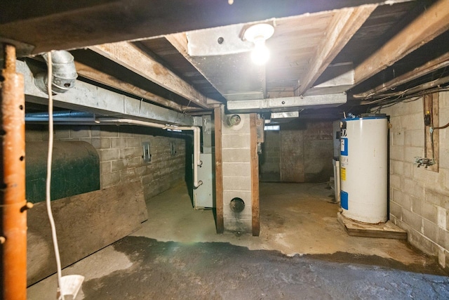 unfinished below grade area featuring heating fuel, heating unit, and water heater