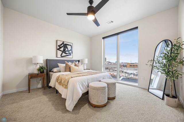 234 Main Ave Unit 716, Fargo, ND 58103 - carpeted bedroom with access to exterior, multiple windows, and ceiling fan