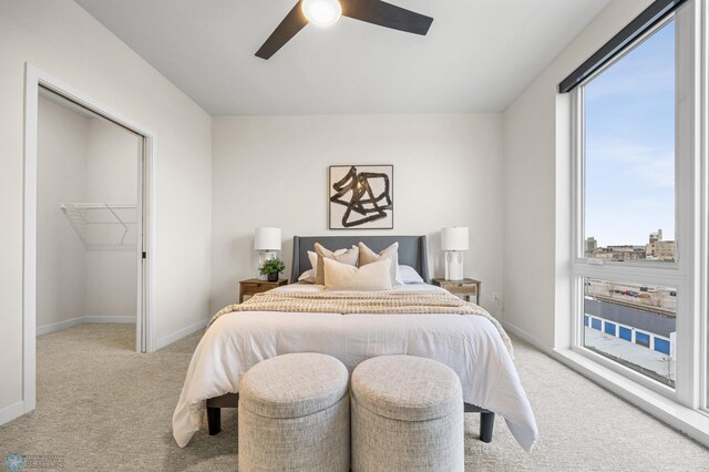 234 Main Ave Unit 716, Fargo, ND 58103 - bedroom featuring carpet floors, a ceiling fan, and a spacious closet