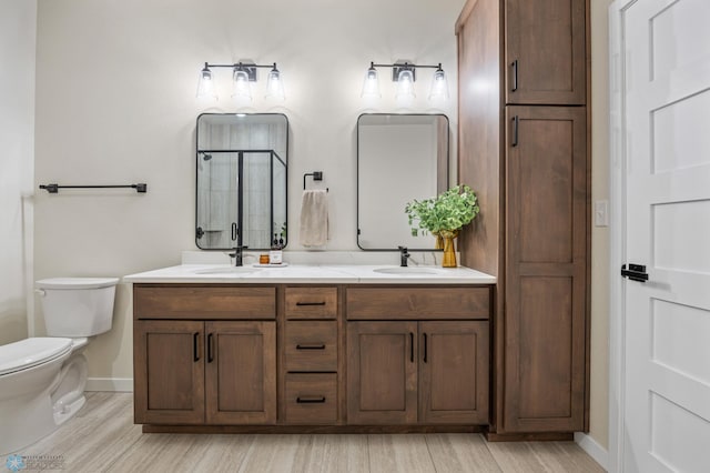 234 Main Ave Unit 716, Fargo, ND 58103 - full bath featuring wood finished floors, double vanity, and a shower