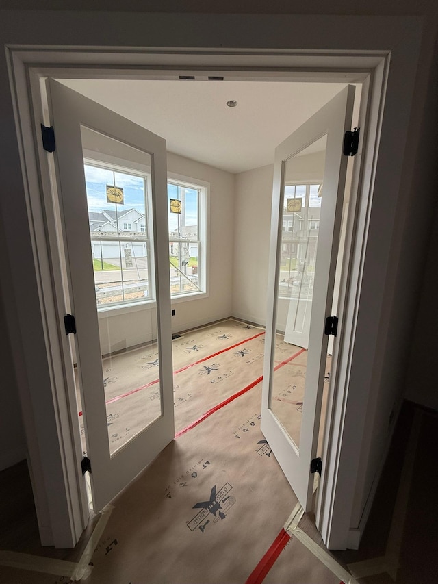 10155 Arrowwood Trl, Woodbury, MN 55129 - doorway to outside with light colored carpet