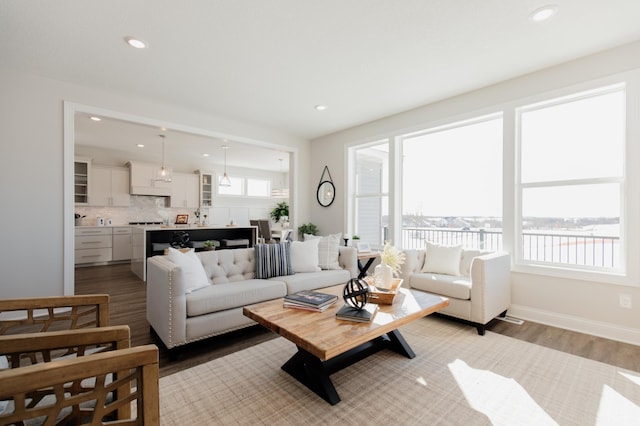 10155 Arrowwood Trl, Woodbury, MN 55129 - living room with light wood-style floors, recessed lighting, and baseboards
