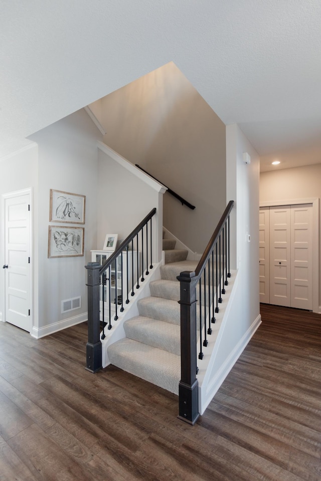 10155 Arrowwood Trl, Woodbury, MN 55129 - staircase featuring wood finished floors, baseboards, and recessed lighting