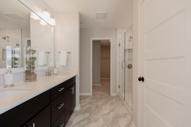 10155 Arrowwood Trl, Woodbury, MN 55129 - full bath with double vanity, a shower stall, baseboards, marble finish floors, and a walk in closet