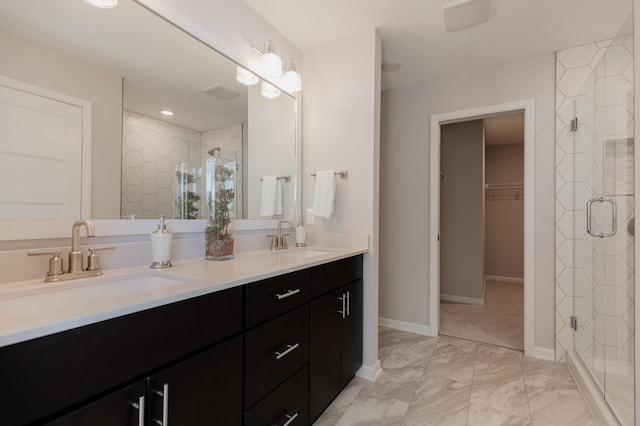 10155 Arrowwood Trl, Woodbury, MN 55129 - full bath with a shower stall, double vanity, a walk in closet, baseboards, and marble finish floors