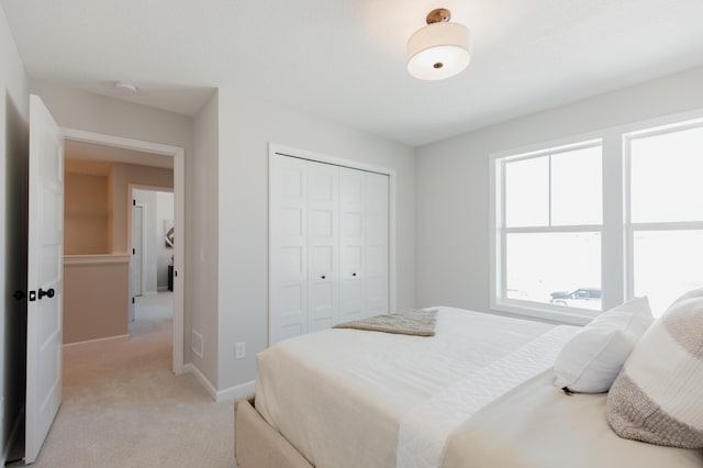 10155 Arrowwood Trl, Woodbury, MN 55129 - bedroom featuring light colored carpet, a closet, and baseboards