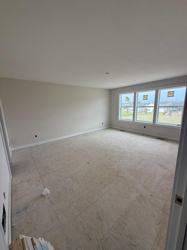 10155 Arrowwood Trl, Woodbury, MN 55129 - unfurnished room with baseboards
