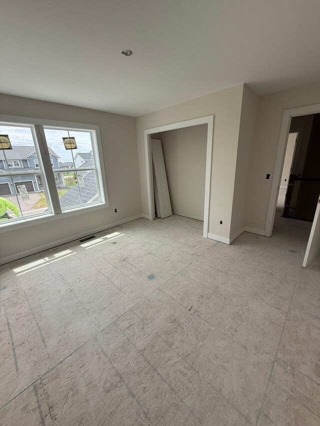 10155 Arrowwood Trl, Woodbury, MN 55129 - unfurnished bedroom featuring baseboards