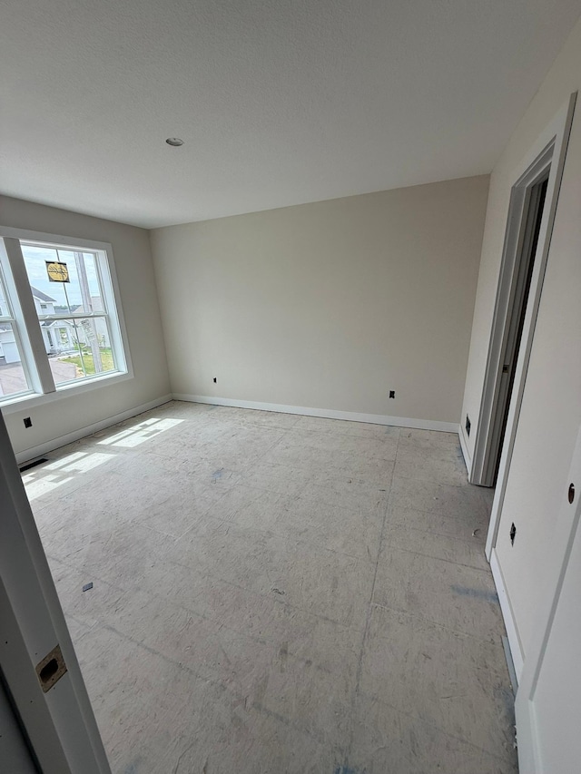 10155 Arrowwood Trl, Woodbury, MN 55129 - empty room featuring baseboards
