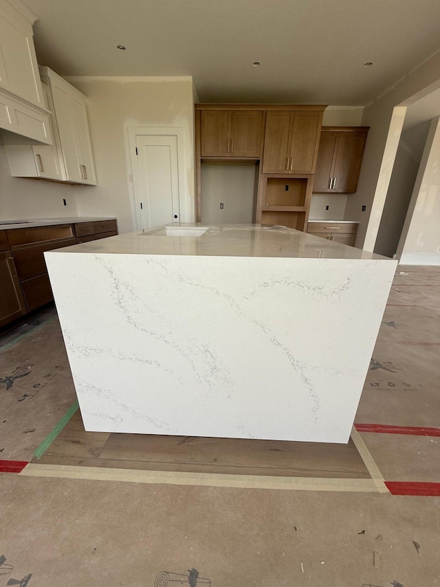 10155 Arrowwood Trl, Woodbury, MN 55129 - kitchen with a spacious island and light stone counters