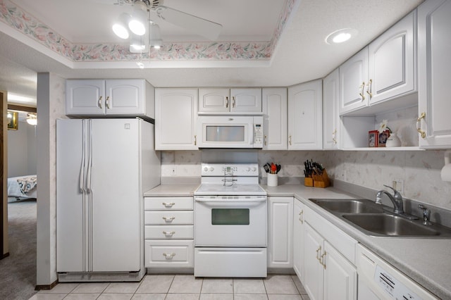 4710 58th Ave N Unit 219, Crystal, MN 55429 - kitchen with white appliances, white cabinets, light tile patterned floors, and light countertops