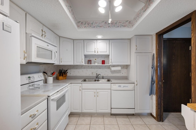 4710 58th Ave N Unit 219, Crystal, MN 55429 - kitchen featuring white appliances, light tile patterned floors, light countertops, and white cabinets