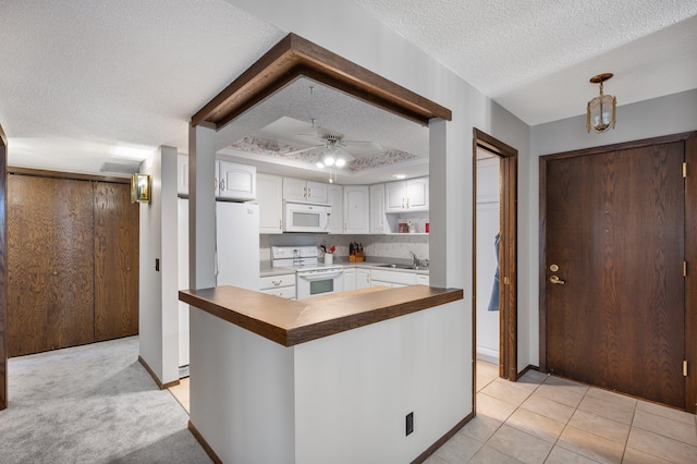 4710 58th Ave N Unit 219, Crystal, MN 55429 - kitchen featuring white appliances, a textured ceiling, butcher block countertops, white cabinetry, and a ceiling fan