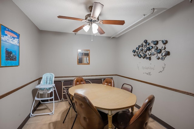 4710 58th Ave N Unit 219, Crystal, MN 55429 - dining room featuring ceiling fan and a textured ceiling