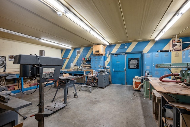 4710 58th Ave N Unit 219, Crystal, MN 55429 - miscellaneous room featuring a workshop area and concrete flooring