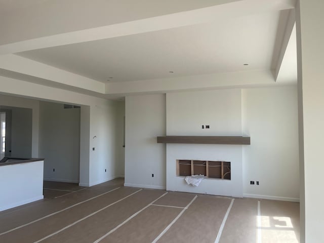 unfurnished living room featuring a fireplace