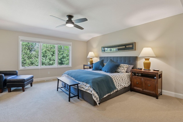 bedroom with baseboards, a ceiling fan, and light colored carpet