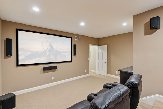cinema room featuring baseboards, recessed lighting, light carpet, and visible vents