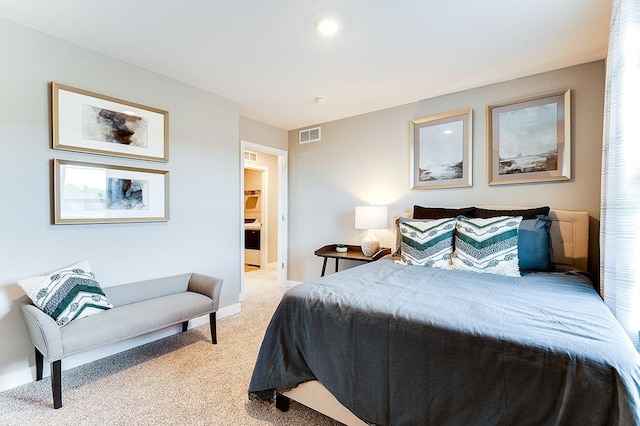 bedroom featuring baseboards, visible vents, and light colored carpet