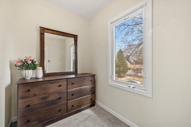 interior space with baseboards and multiple windows