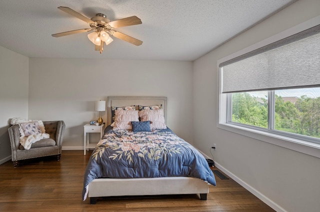 10351 Kittredge Pkwy NE, Otsego, MN 55301 - bedroom with wood finished floors, a textured ceiling, and a ceiling fan