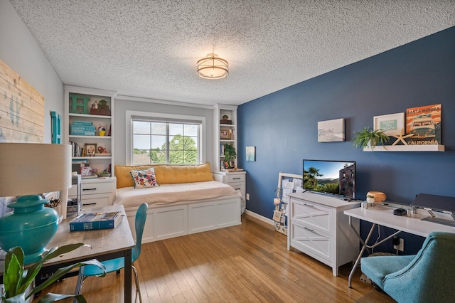 10351 Kittredge Pkwy NE, Otsego, MN 55301 - office area with a textured ceiling, wood finished floors, and built in shelves