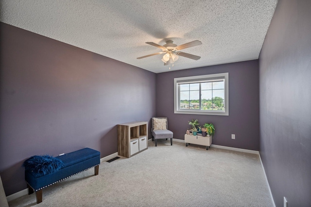 10351 Kittredge Pkwy NE, Otsego, MN 55301 - sitting room featuring a textured ceiling, a ceiling fan, and carpet