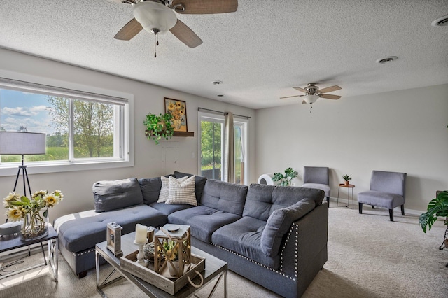 10351 Kittredge Pkwy NE, Otsego, MN 55301 - living area featuring a ceiling fan, carpet floors, and a textured ceiling