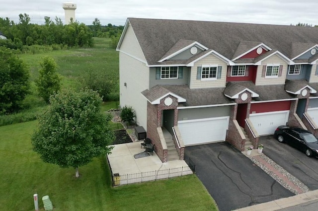 10351 Kittredge Pkwy NE, Otsego, MN 55301 - view of front of home with driveway, a garage, a shingled roof, and a front lawn
