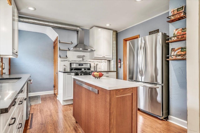 kitchen featuring open shelves, white cabinetry, wall chimney range hood, and stainless steel appliances