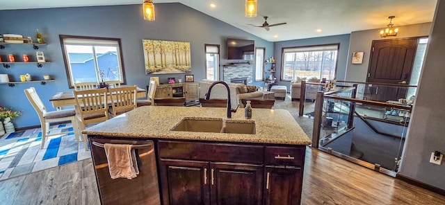 kitchen with dishwashing machine, pendant lighting, a sink, and ceiling fan