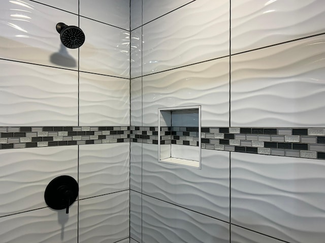 full bathroom with a tile shower