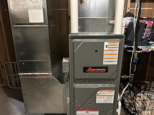 utility room with heating unit