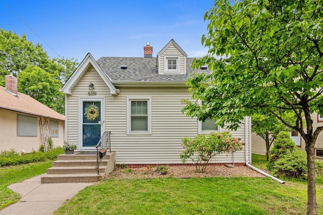 5319 38th Ave S, Minneapolis, MN 55417 - view of front of home featuring a front yard, roof with shingles, and a chimney