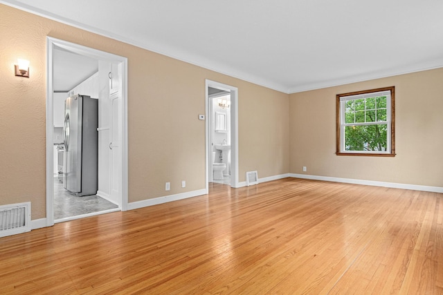 5319 38th Ave S, Minneapolis, MN 55417 - unfurnished room featuring light wood-style flooring, baseboards, and ornamental molding
