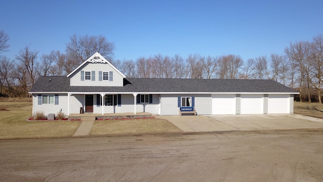 40749 Greencrest Rd, Crow River Twp, MN 56312 - view of front of house featuring roof with shingles, a porch, concrete driveway, a garage, and a front yard