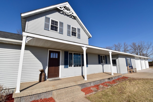 40749 Greencrest Rd, Crow River Twp, MN 56312 - traditional-style house featuring a garage, a front yard, and covered porch